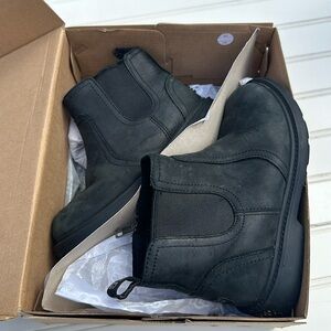 Ugg boots size 12 style T Bolden weather in black. like new in original box